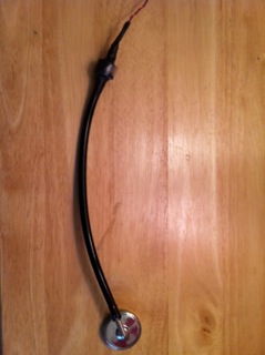 Stethoscope head with microphone coupling, which leads into the junction box