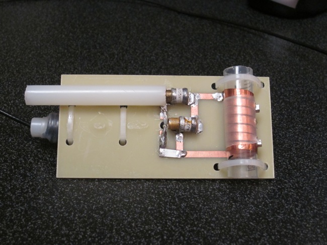 MR Coil: an example of a coil used to collect data with the MR scanner. The bioreactor cartridge will be slid into a copper solenoid, like the one on the right of the image. The more tightly the coil fits around the cartridge, the higher the resolution will be of the resulting scan.