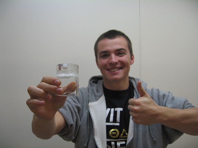 Alex holding last semesters design (19.0 %w/w Poloxamer 407 solution) post gelation. This fluid is being optimized this semester for lower viscosity and increased bioadhesion.
