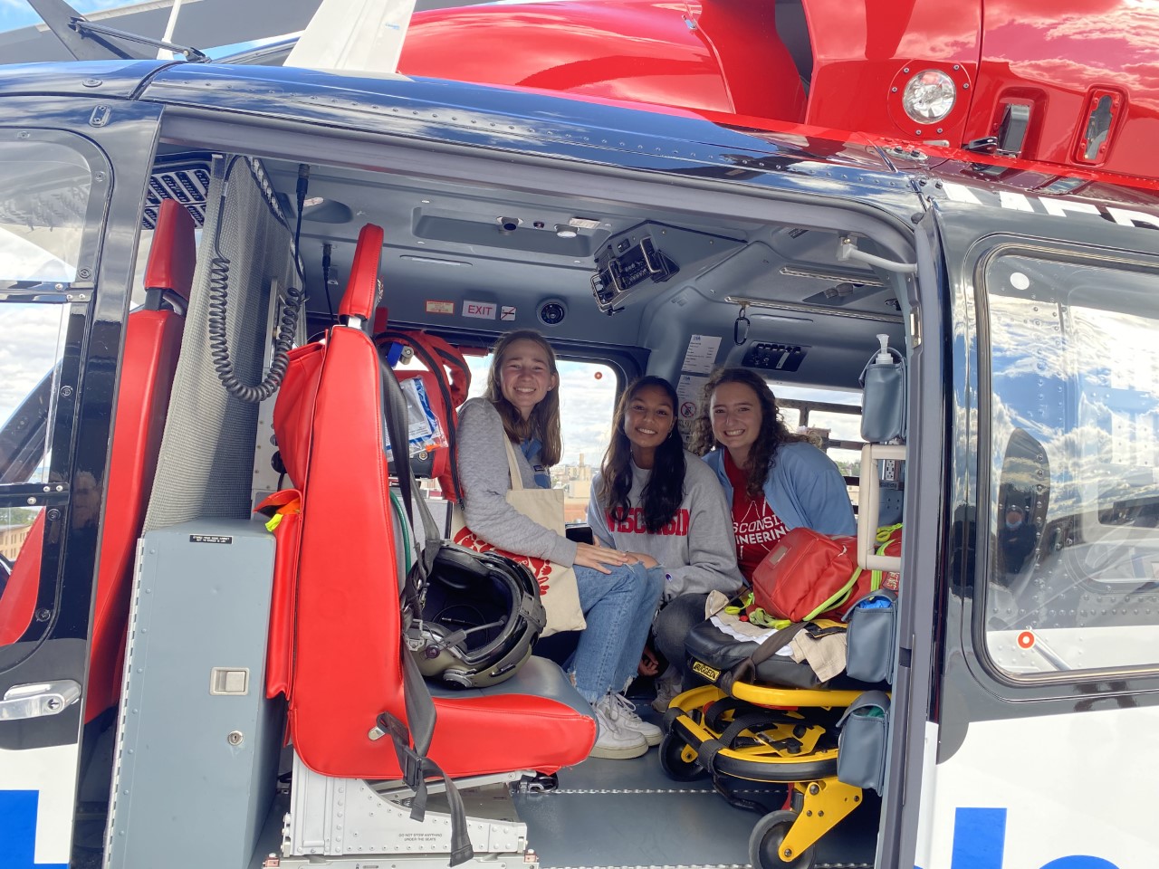 Visit to UW Health- Greta, Neha, and Julia in the helicopter