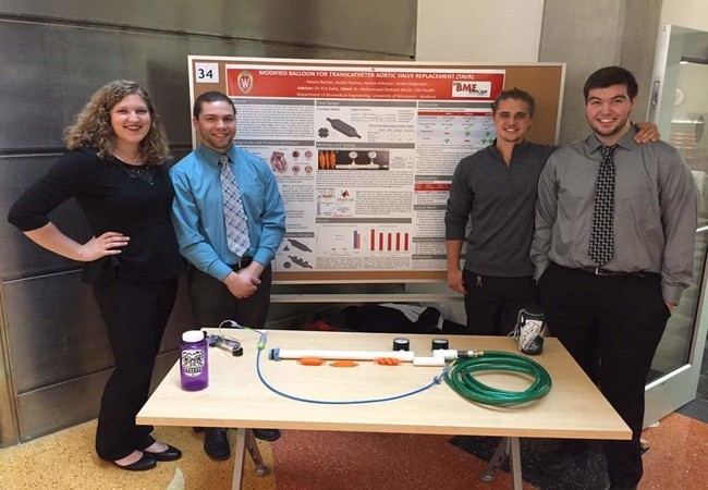 Spring 17 Poster Session: Team members standing in front of poster and final prototype at the BME Design Poster Session (Awarded Honorable Mention for BME Design Excellence Award)